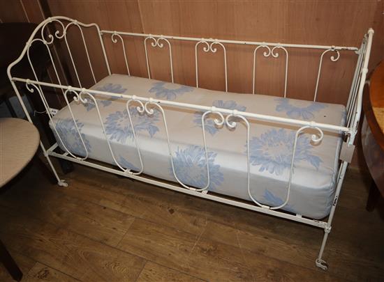 A late Victorian painted wrought iron crib, with mattress L.144cm